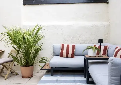 Private courtyard garden with outdoor sofa