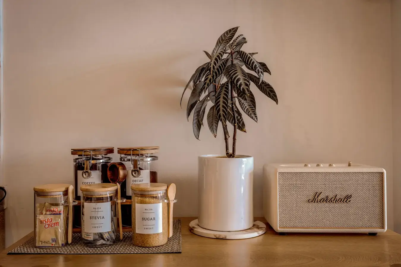 A coffee station with labelled jars set out for guests