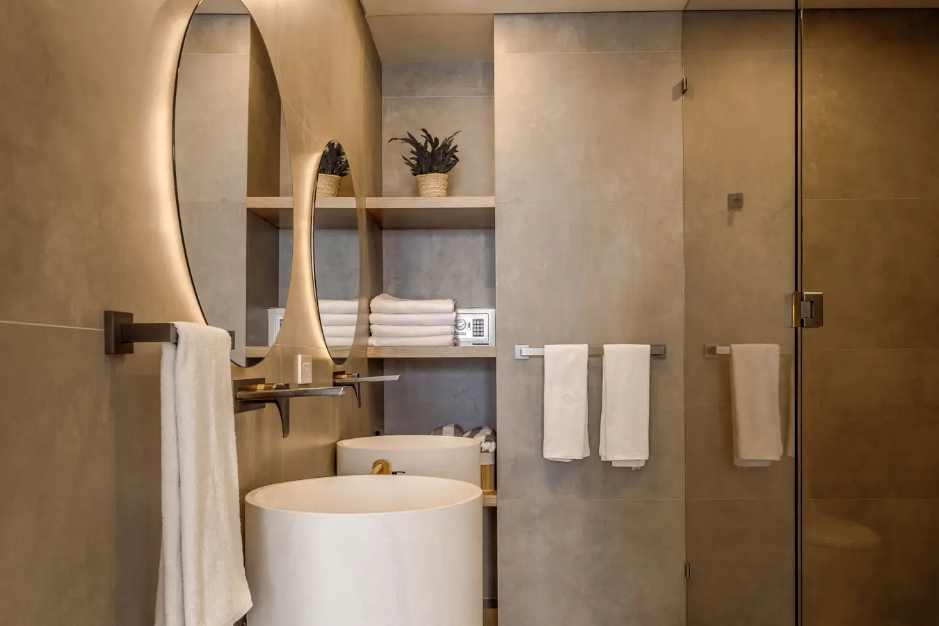 A modern bathroom with fresh towels on the rails