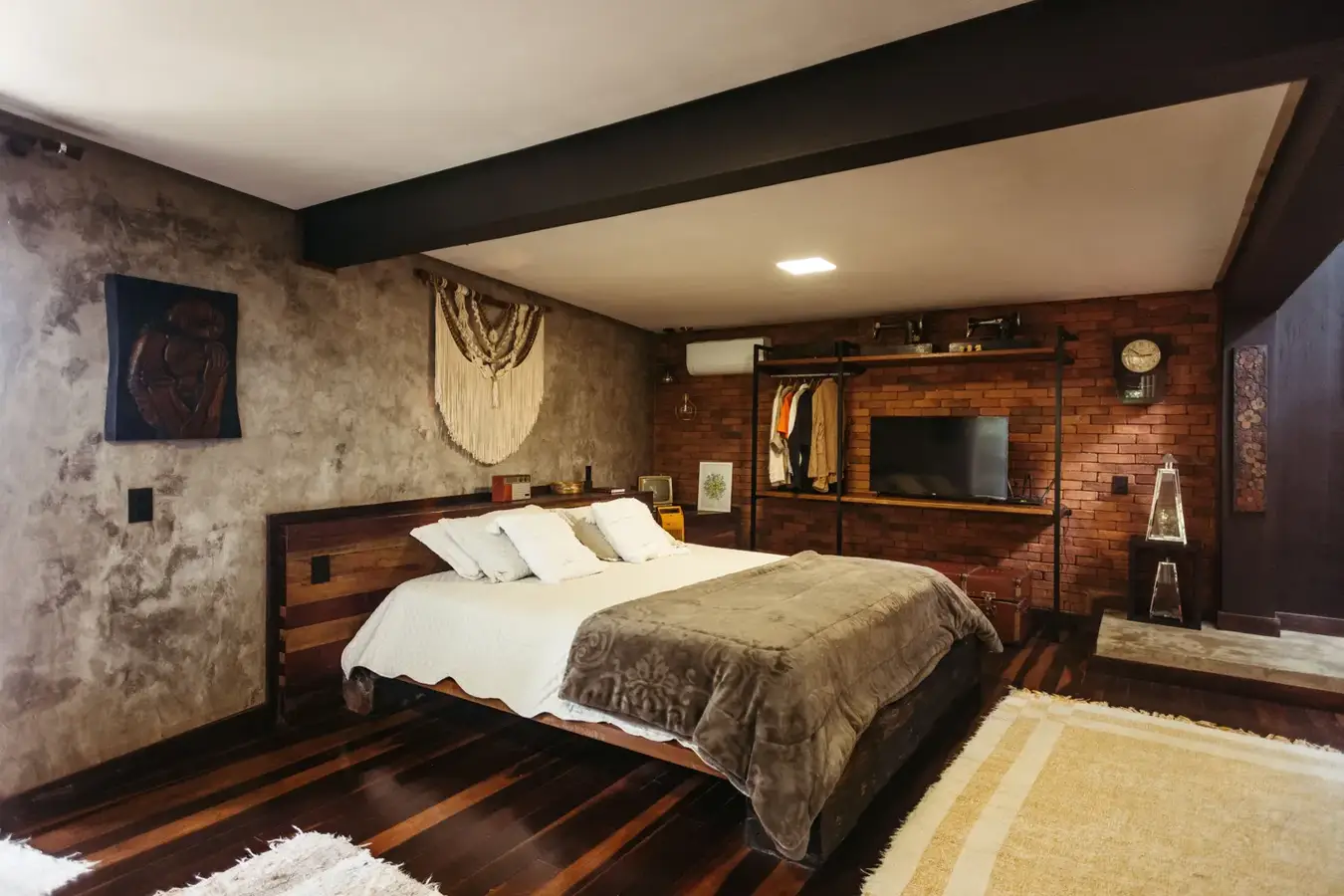 A made-up double bed in a guest bedroom