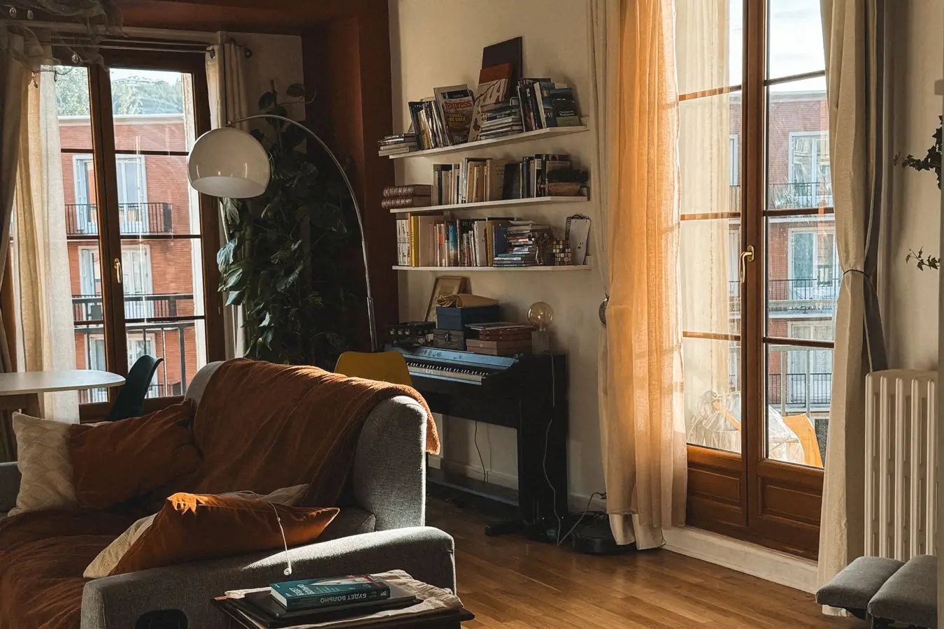 A sunlit flat with a suitcase just inside the door